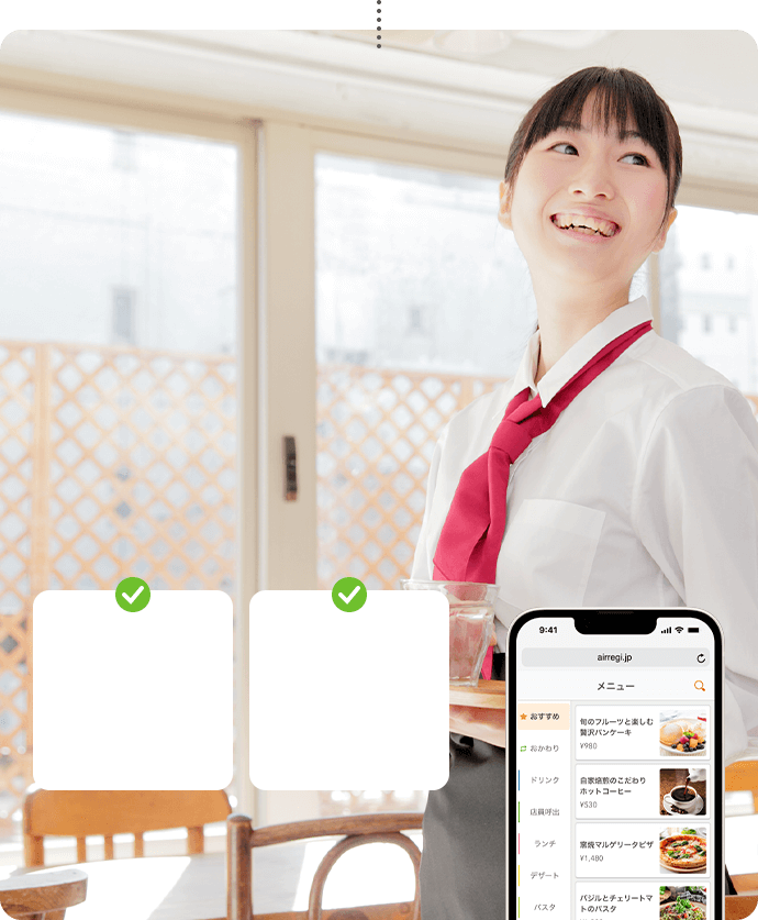 写真：モバイルオーダーと接客中の店員